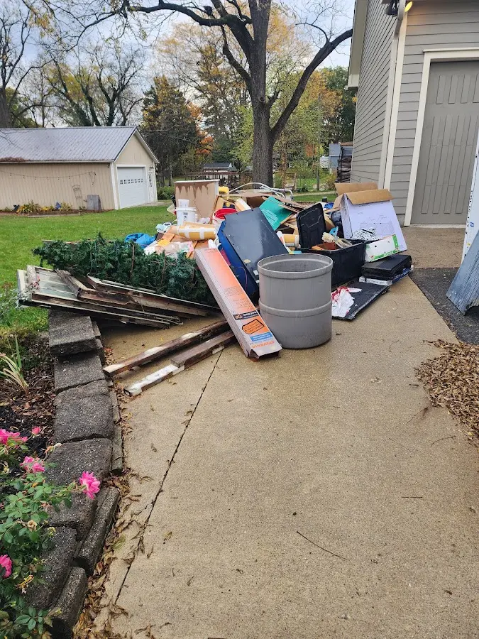 Dumpster being loaded with debris for Roofing Dumpster Rental in Manteno